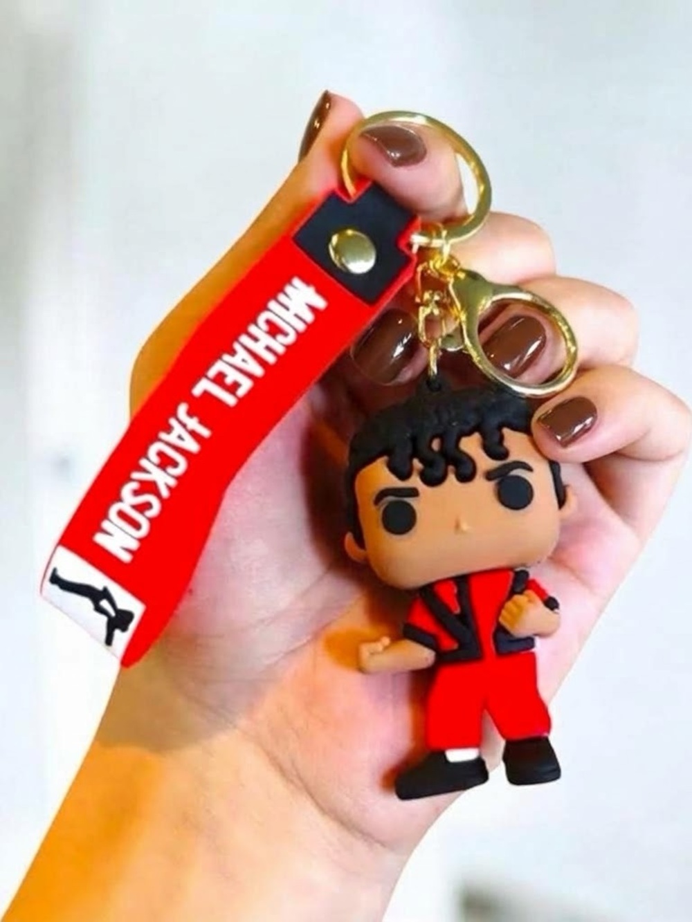 Red Character Strap Keychain with Gold Hardware
